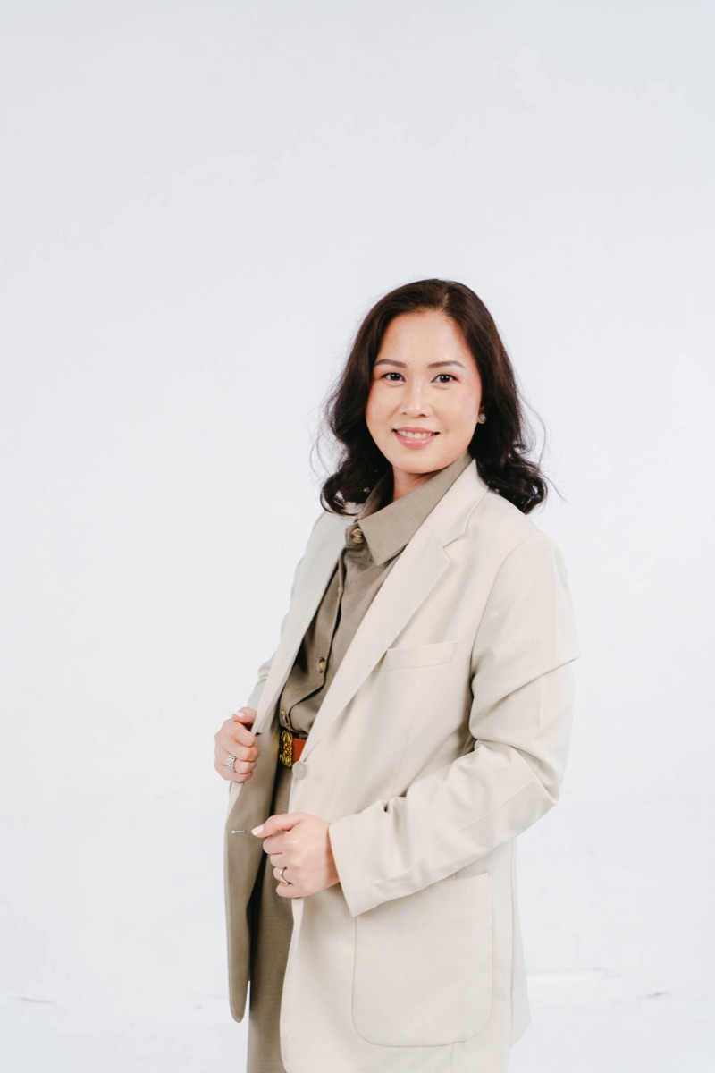 Portrait of Gigi in a light suit